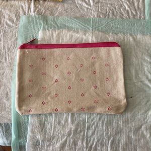 Ipsy cream and pink makeup bag